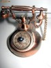 Bricheta telefon de birou din metal aramit cu receptor care se ridica si buton declansator de pe central discului