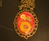Colier steampunk  (lant lung),culori: bronz, rosu (realizat din piese de ceas prinse in rasina) Unicat