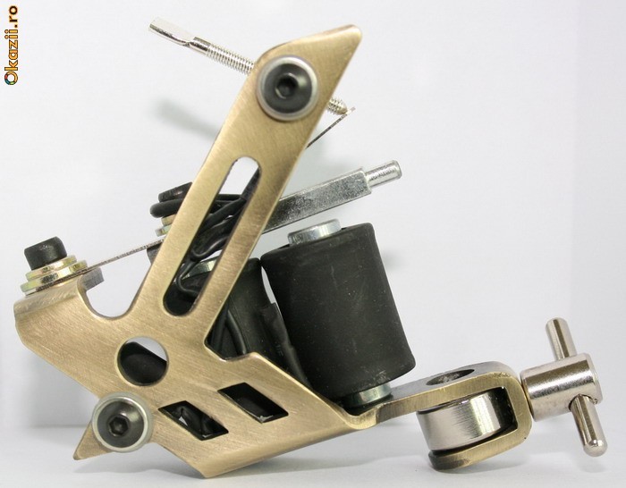 tattoo machine golden X foto mare