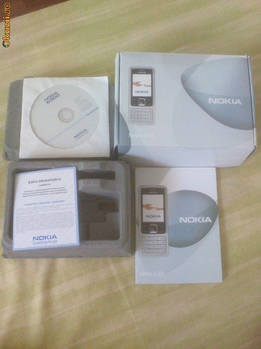 Cutie de la nokia 6300 + cd +carticele foto mare
